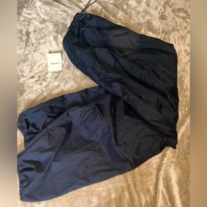 Never been worn parachute pants with tags on